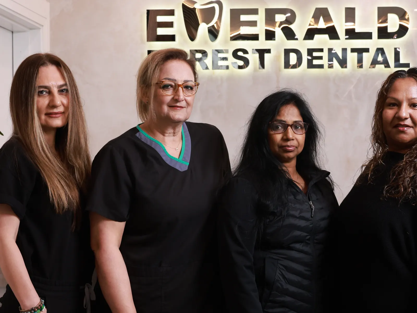 Team members standing together at the clinic at Emerald Forest Dental Clinic in North York