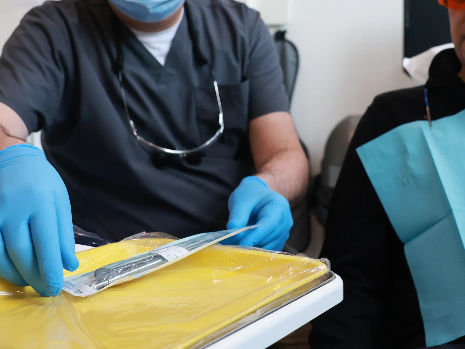 Dentist preparing instruments on the tray at Emerald Forest Dental Clinic in North York