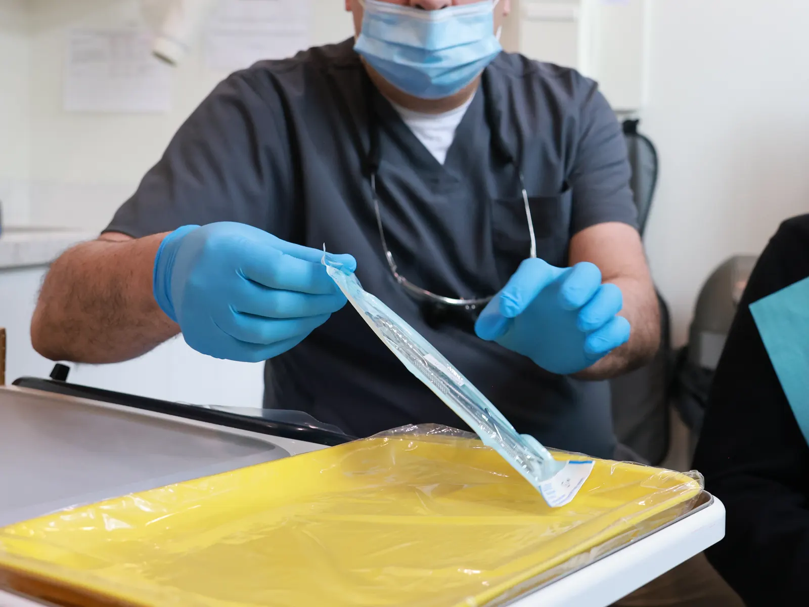 Dentist preparing for a patient's visit at Emerald Forest Dental Clinic in North York