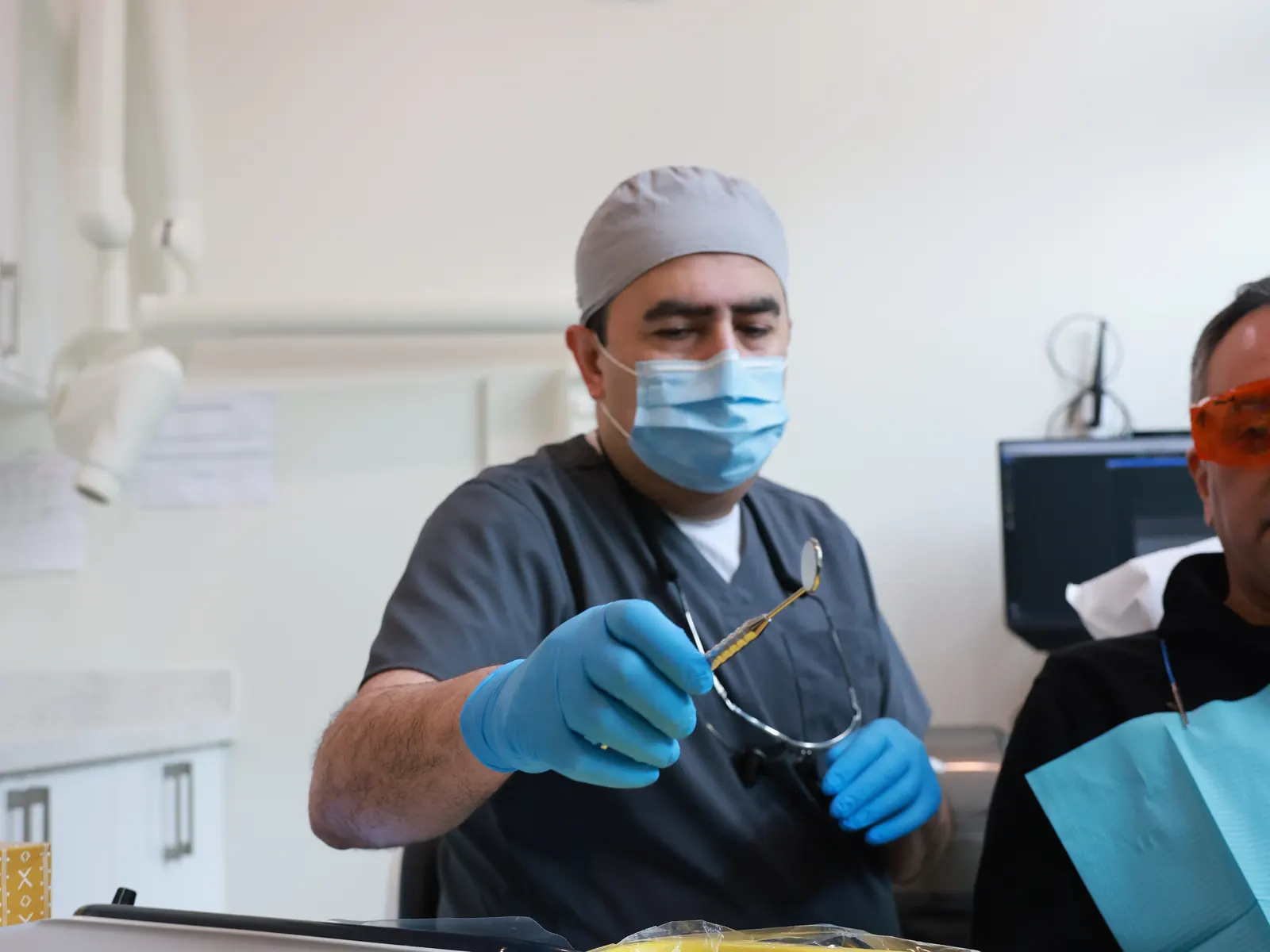 Dentist ready to treat a patient at Emerald Forest Dental Clinic in North York