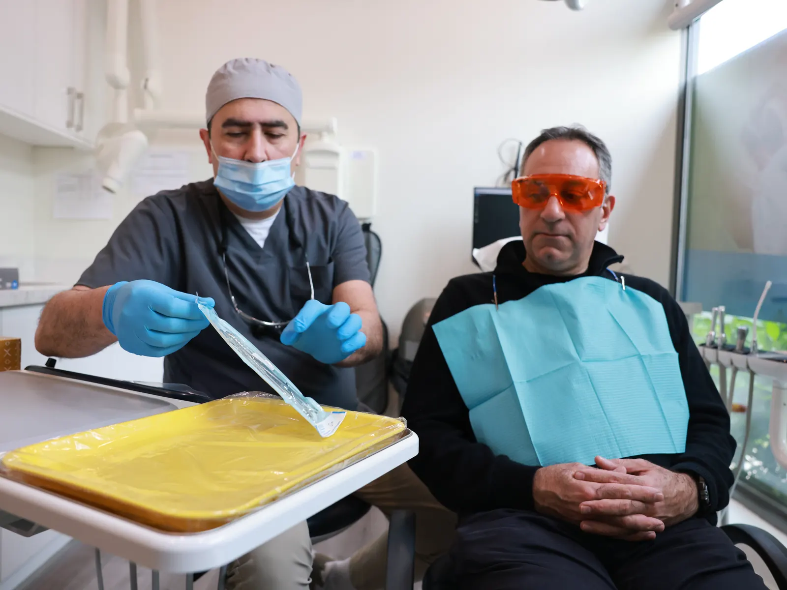 Dentist and patient getting ready for treatment at Emerald Forest Dental Clinic in North York