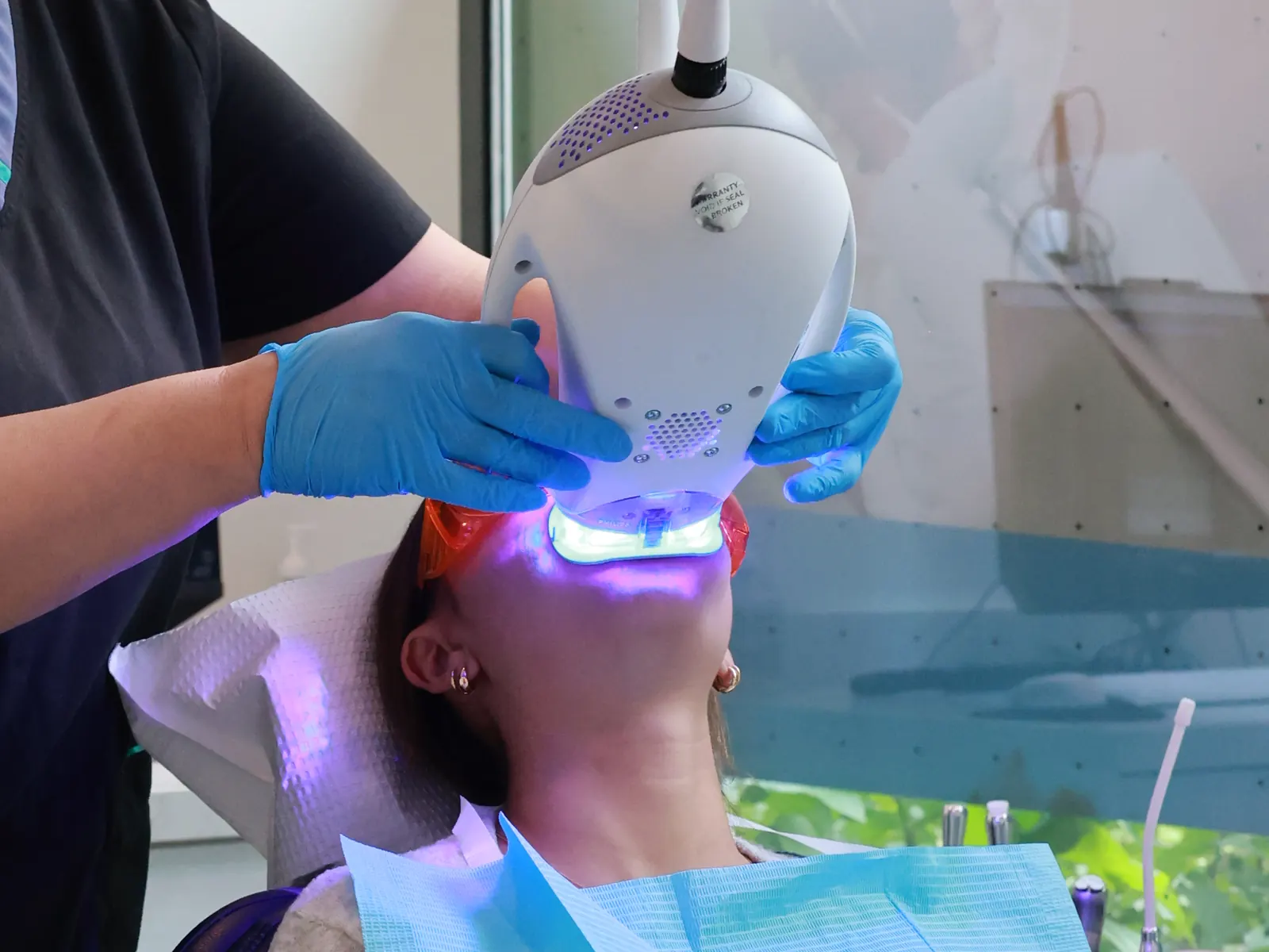 Close-up of the blue curing light in use at Emerald Forest Dental Clinic in North York