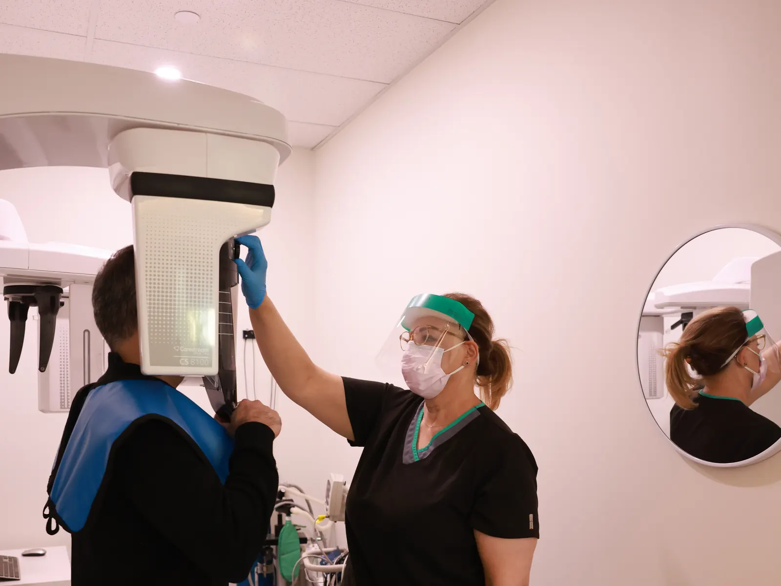 Hygienist setting up a panoramic X-ray at Emerald Forest Dental Clinic in North York